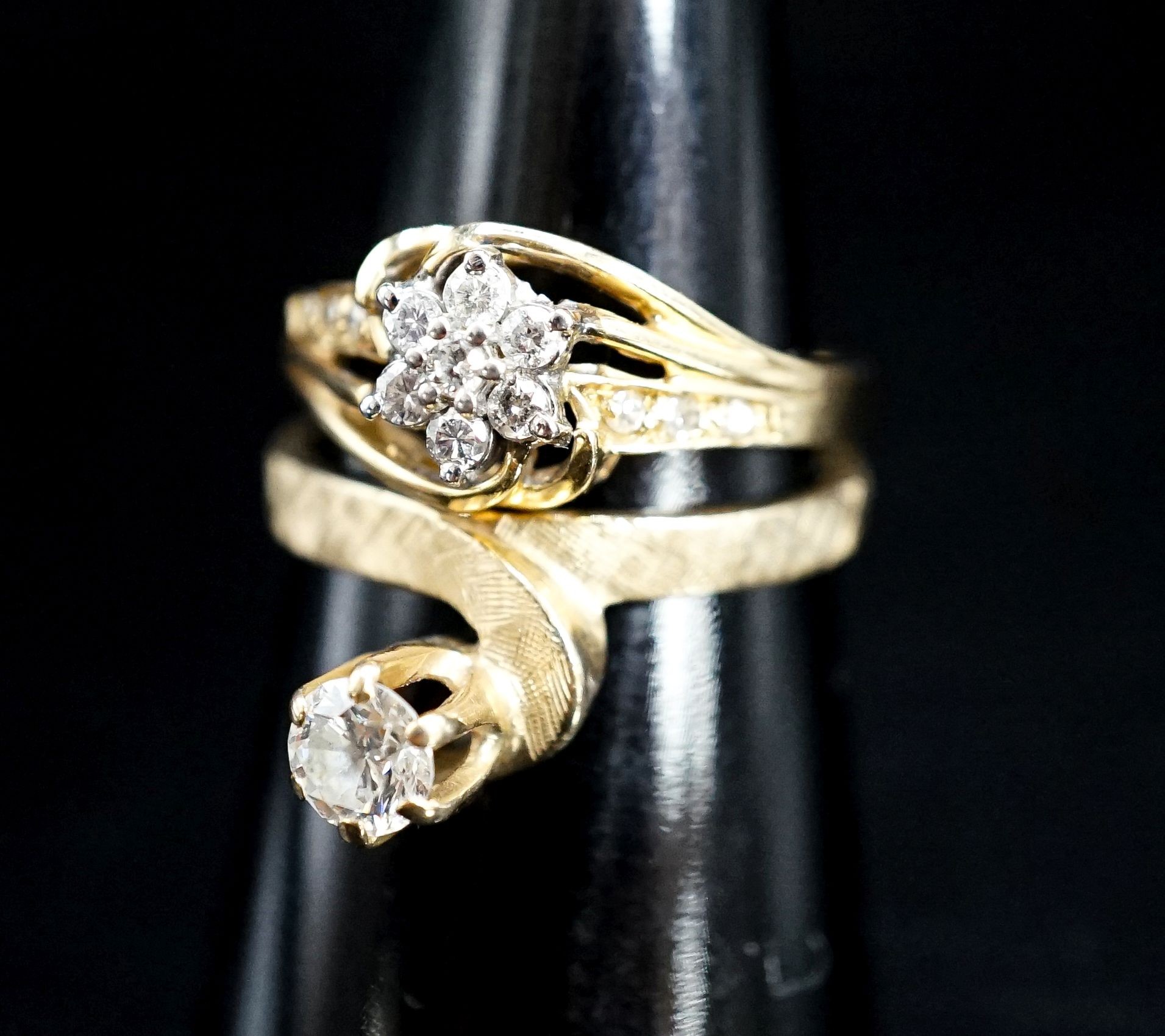 A modern 14k and solitaire diamond ring, size O/P and one other 14k and diamond cluster ring, gross 6.1 grams.